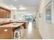 Open concept kitchen with granite countertops and seamless flow into living space at 17118 Vardon Ter # 304, Bradenton, FL 34211