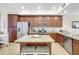 Modern kitchen with stainless steel appliances and granite countertops on island at 17118 Vardon Ter # 304, Bradenton, FL 34211