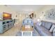 Spacious living room with comfortable seating area and open layout to the kitchen at 17118 Vardon Ter # 304, Bradenton, FL 34211