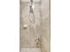 Shower stall showcases tiled walls, an adjustable shower head, and helpful storage at 17118 Vardon Ter # 304, Bradenton, FL 34211