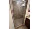 Bathroom with tile shower and glass door at 17118 Vardon Ter # 304, Bradenton, FL 34211