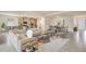 Open concept living room and kitchen with modern decor, dining room, and tile flooring at 17142 James Trl, Parrish, FL 34219