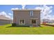A spacious backyard with a cozy patio and a well-maintained lawn at 1844 Cobb Trl, Parrish, FL 34219