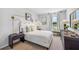 This is a stylish bedroom features neutral colored walls and accents and a bright window at 1844 Cobb Trl, Parrish, FL 34219