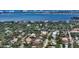 Overhead shot showcases the home's location, water views, mature trees, and neighborhood at 1910 Datura St, Sarasota, FL 34239