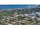Home's picturesque location with water views, surrounded by trees and lush neighborhood at 1910 Datura St, Sarasota, FL 34239