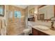 Elegant bathroom featuring a glass-enclosed shower, vanity with vessel sink, and stylish fixtures at 1910 Datura St, Sarasota, FL 34239
