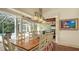 Elegant dining area with pool access and outdoor dining area at 1910 Datura St, Sarasota, FL 34239