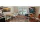 Game room featuring a pinball machine, slot machine, and a cozy seating area for entertainment at 1910 Datura St, Sarasota, FL 34239