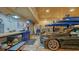 Well-equipped garage featuring a car lift, workbench, and ample storage space for automotive enthusiasts at 1910 Datura St, Sarasota, FL 34239