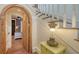 Hallway featuring an arched doorframe and stairwell at 1910 Datura St, Sarasota, FL 34239