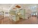 Well-appointed kitchen with a spacious island, pendant lighting, and hardwood floors creating a stylish and functional space at 1910 Datura St, Sarasota, FL 34239