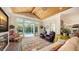 Stylish living room with hardwood floors, pool views, and unique decor, offering a comfortable living space at 1910 Datura St, Sarasota, FL 34239
