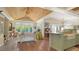 Bright living room featuring beautiful hard wood flooring, ceiling fan, and natural light with yard views at 1910 Datura St, Sarasota, FL 34239
