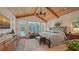 Spacious main bedroom with wood-paneled ceiling, ample natural light, and decorative furnishings at 1910 Datura St, Sarasota, FL 34239