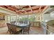 Inviting outdoor kitchen features stainless appliances, stone accents, dining area, and ceiling fan at 1910 Datura St, Sarasota, FL 34239