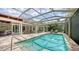 Inviting screened-in pool area with outdoor dining and lounge seating for relaxation and entertaining at 1910 Datura St, Sarasota, FL 34239