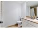 Bathroom with a white toilet, tile floors, and a mirror at 2049 E Leewynn Dr, Sarasota, FL 34240