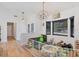Light and airy bonus room with white walls, wood floors, and ample natural light at 2049 E Leewynn Dr, Sarasota, FL 34240