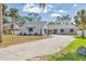 Charming home with a well-manicured lawn and a long driveway at 2049 E Leewynn Dr, Sarasota, FL 34240