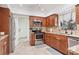 Modern kitchen featuring stainless steel appliances, granite countertops, and ample cabinet space at 2049 E Leewynn Dr, Sarasota, FL 34240