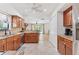 Open-concept kitchen with stainless steel appliances, granite countertops, and access to the living room at 2049 E Leewynn Dr, Sarasota, FL 34240