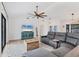 Cozy living room boasts modern decor, a comfortable couch, and natural light from the windows at 2049 E Leewynn Dr, Sarasota, FL 34240