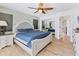 Spacious main bedroom featuring wood floors, a ceiling fan, and ample natural light at 2049 E Leewynn Dr, Sarasota, FL 34240