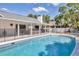 Relaxing backyard with a fenced pool and covered patio that offers a shady retreat at 2049 E Leewynn Dr, Sarasota, FL 34240