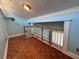 This balcony with hardwood flooring is perfect for relaxing and enjoying views at 2058 Sunset Point Rd # 11, Clearwater, FL 33765