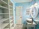 Charming bathroom with a unique sink, vanity and built-in storage at 2058 Sunset Point Rd # 11, Clearwater, FL 33765