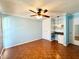 Bedroom with wood parquet flooring, large closet and small desk at 2058 Sunset Point Rd # 11, Clearwater, FL 33765