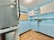 Functional utility room with shelving, storage cabinets and water heater at 2058 Sunset Point Rd # 11, Clearwater, FL 33765