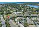 Aerial view highlighting the property's convenient location near water, a pool, and ample parking at 220 Coquina Bay Dr, St Petersburg, FL 33705
