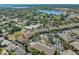 An aerial view shows a charming condo community with a swimming pool and lush landscaping at 220 Coquina Bay Dr, St Petersburg, FL 33705
