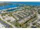 Aerial view of the property showcasing its location near the water and local amenities at 220 Coquina Bay Dr, St Petersburg, FL 33705