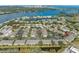 Aerial view of the community highlighting its location on the water and near amenities at 220 Coquina Bay Dr, St Petersburg, FL 33705