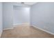 Bedroom features neutral-toned walls and carpeting at 220 Coquina Bay Dr, St Petersburg, FL 33705