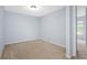 Bedroom features neutral-toned walls and carpeting at 220 Coquina Bay Dr, St Petersburg, FL 33705