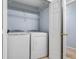 Laundry room features a washer and dryer, and wire shelving at 220 Coquina Bay Dr, St Petersburg, FL 33705