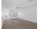 Bright and airy living room with carpet, large windows, and ample natural light at 220 Coquina Bay Dr, St Petersburg, FL 33705