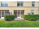 Private screened patio offers a peaceful outdoor space surrounded by lush landscaping at 220 Coquina Bay Dr, St Petersburg, FL 33705