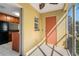 Enclosed patio features tiled flooring, a ceiling fan, and a view of the kitchen through a sliding glass door at 220 Coquina Bay Dr, St Petersburg, FL 33705