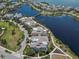 Expansive aerial shot of waterfront houses showcasing a harmonious blend of residential living and scenic coastal beauty at 230 Sapphire Lake Dr # 201, Bradenton, FL 34209