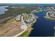 Stunning aerial view of waterfront homes with lush landscaping and lake access at 230 Sapphire Lake Dr # 201, Bradenton, FL 34209