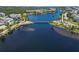 Breathtaking aerial view of a serene lake with a charming wooden bridge at 230 Sapphire Lake Dr # 201, Bradenton, FL 34209
