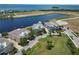 Gorgeous aerial shot of lakeside properties with beautifully landscaped yards, providing a picturesque community setting at 230 Sapphire Lake Dr # 201, Bradenton, FL 34209