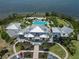 Overhead shot showcasing a community clubhouse, pool, and manicured landscaping at 230 Sapphire Lake Dr # 201, Bradenton, FL 34209