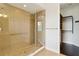 Bathroom featuring tiled walk-in shower with glass enclosure and walk-in closet at 230 Sapphire Lake Dr # 201, Bradenton, FL 34209