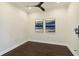 Modern bedroom boasting hardwood floors, a ceiling fan, and artwork on the wall for a stylish and inviting space at 230 Sapphire Lake Dr # 201, Bradenton, FL 34209
